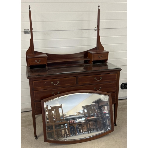 1444 - An Edwardian satin wood dressing table with inlaid detail, tapered legs and brass caster feet. Curve... 