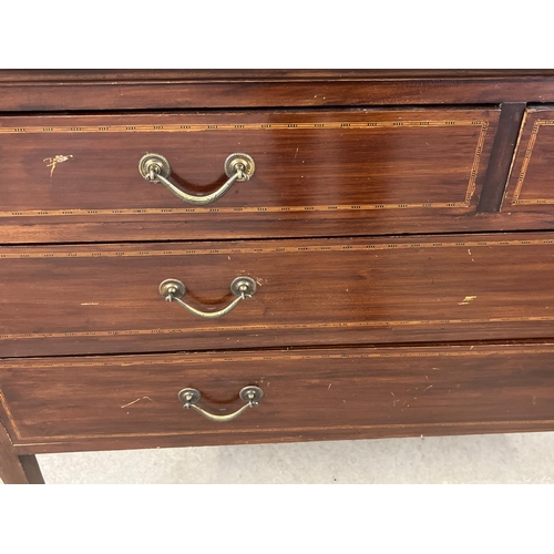 1444 - An Edwardian satin wood dressing table with inlaid detail, tapered legs and brass caster feet. Curve... 