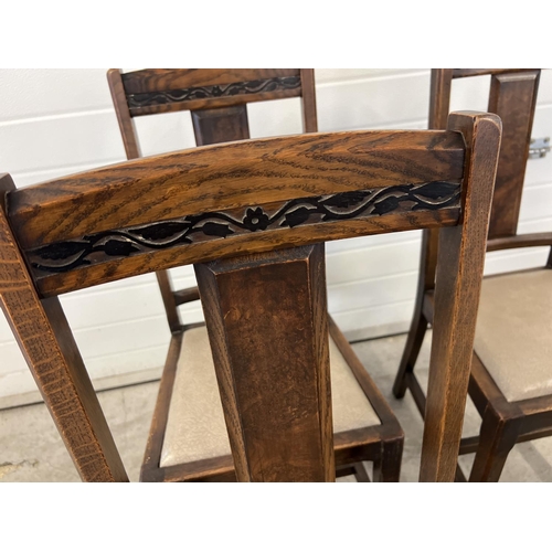 1446 - A set of 4 vintage Art Deco dining chairs with carved floral detail to backs. Drop in seats upholste... 