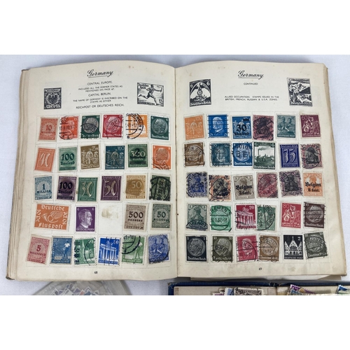 66A - 2 vintage stamp albums containing assorted world stamps, together with a few loose stamps.