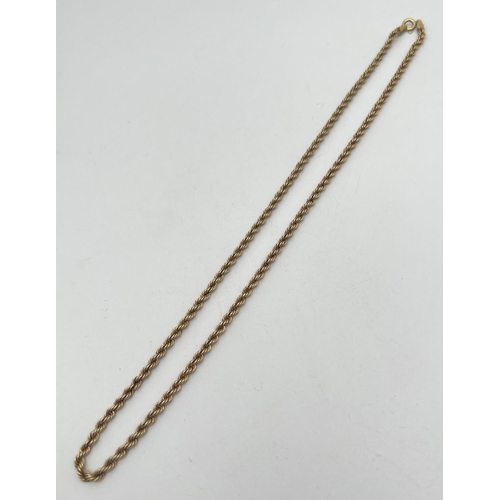 1079 - An 18 inch 9ct gold rope chain with spring ring clasp. Gold mark to clasp and fixings. Total weight ... 