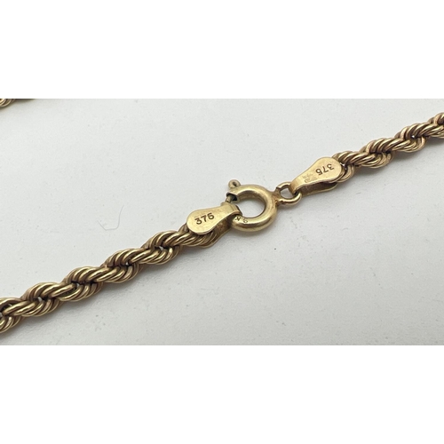 1079 - An 18 inch 9ct gold rope chain with spring ring clasp. Gold mark to clasp and fixings. Total weight ... 