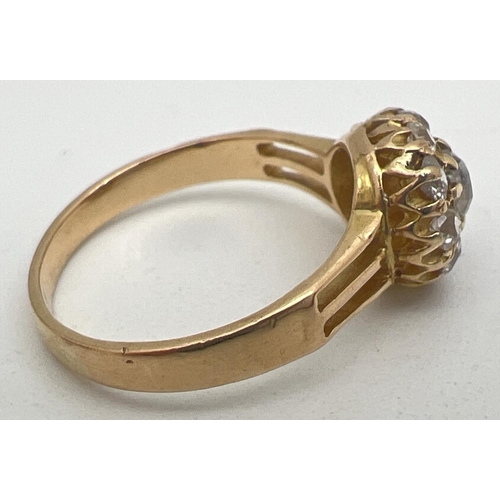 1083 - A vintage yellow gold 1ct diamond halo set cluster ring. Central round cut stone surrounded by 9 var... 