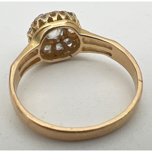 1083 - A vintage yellow gold 1ct diamond halo set cluster ring. Central round cut stone surrounded by 9 var... 