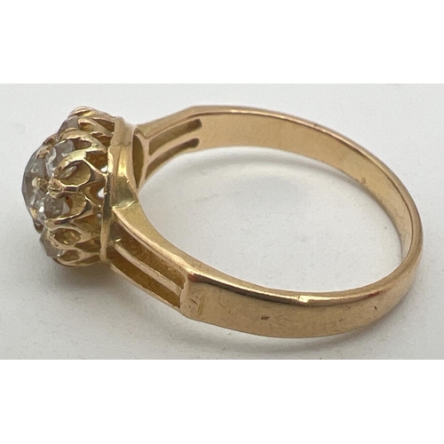 1083 - A vintage yellow gold 1ct diamond halo set cluster ring. Central round cut stone surrounded by 9 var... 