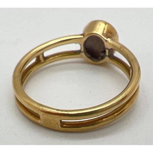 1088 - A bespoke made Macintosh style double band yellow metal dress ring with a bezel set oval grey agate ... 