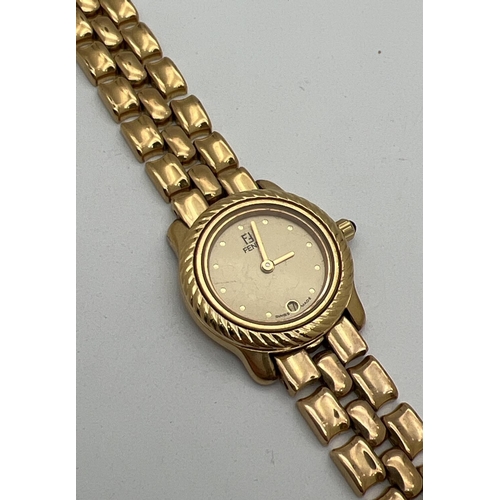 1160 - A ladies 810-L wristwatch by Fendi. Gold tone bracelet strap with Fendi logo to clasp. Gold tone fac... 