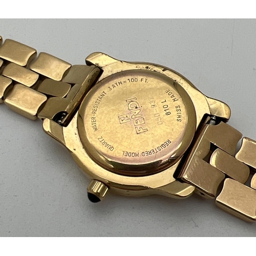 1160 - A ladies 810-L wristwatch by Fendi. Gold tone bracelet strap with Fendi logo to clasp. Gold tone fac... 