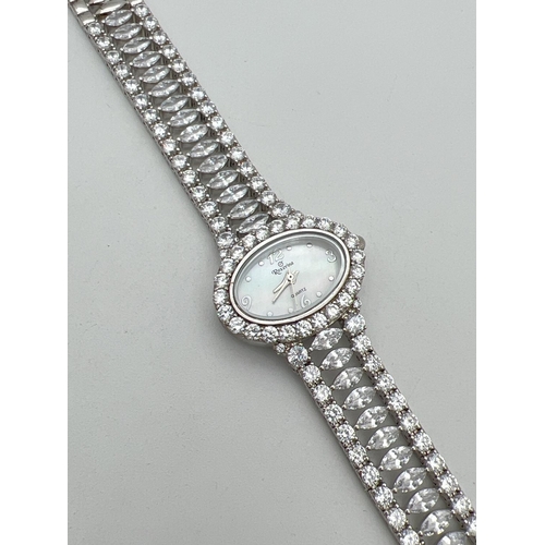 1162 - A ladies quartz wrist watch by Roxerina. Strap set with multiple marquis cut and round cut clear sto... 