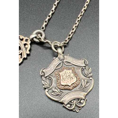 1167 - 2 antique silver fob medallions on a white metal 16 inch belcher chain with white metal Albert. Both... 