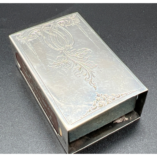 1168 - A vintage Art Nouveau style Dutch silver match box holder with floral detail to both sides and empty... 