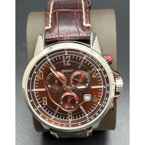 1134 - A men's chronograph NY-1324 wristwatch by DKNY. Metallic brown and stainless steel case and face wit... 