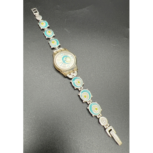 1139 - A 2005 Swatch watch #809, with enamel blue and green circle detail bracelet strap. Brushed silver fa... 