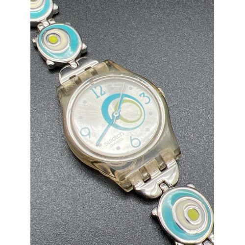 1139 - A 2005 Swatch watch #809, with enamel blue and green circle detail bracelet strap. Brushed silver fa... 