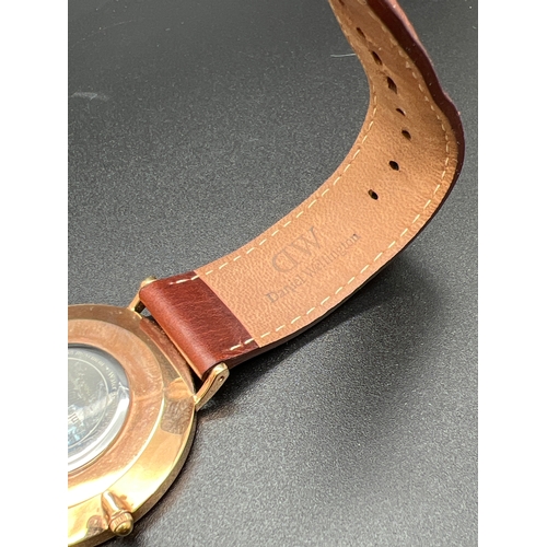 1144 - A Classic G40R01 men's wristwatch by Daniel Wellington. Brown leather strap with gold tone case and ... 