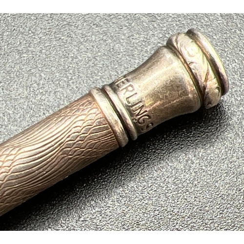 1169 - A vintage sterling silver propelling pencil with engine turned decoration to main body. Approx. 9cm ... 