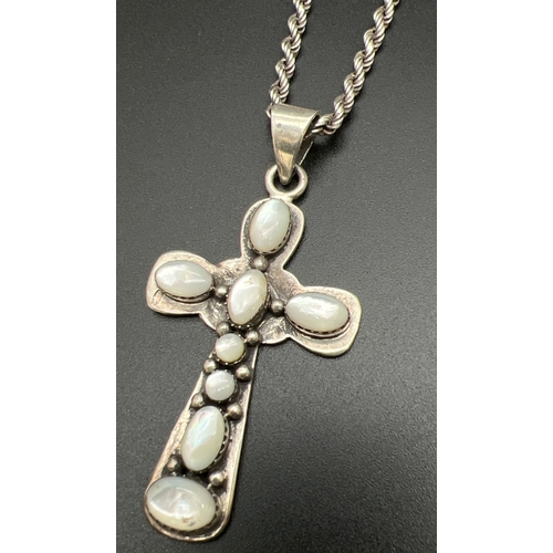 1071 - An Arts & Crafts style large silver cross shaped pendant on an 18