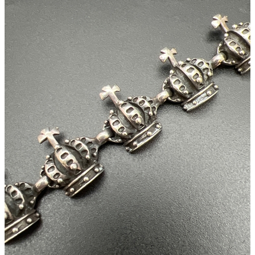 1073 - A heavy 925 sterling silver crown and cross design panel bracelet in the style of Vivienne Westwood.... 