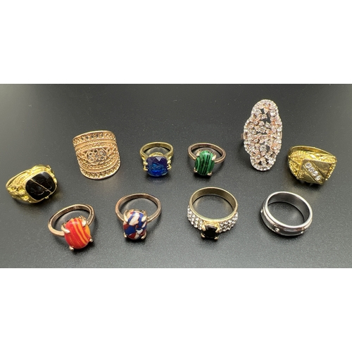 1076 - A collection of 10 assorted costume jewellery rings, in varying sizes and styles. Mostly stone set.