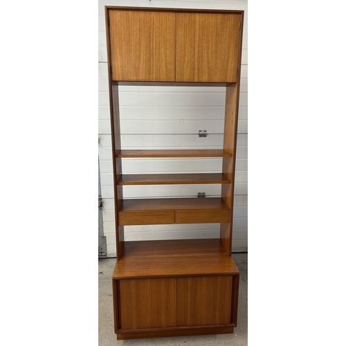 1407 - A mid century G Plan wall unit with sliding door cupboard to base and 2 door cupboard to top. With 2... 