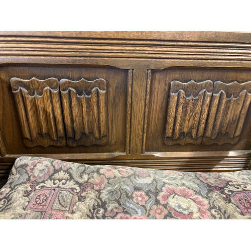 1410 - A vintage Old Charm hall seat with built in cupboard, decorated with linen fold carved detail to sea... 