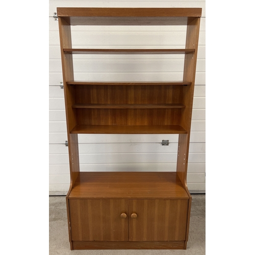 1412 - A mid century teak wall unit with 2 door cupboard, possibly Stag. With wooden knob handles and 3 fix... 