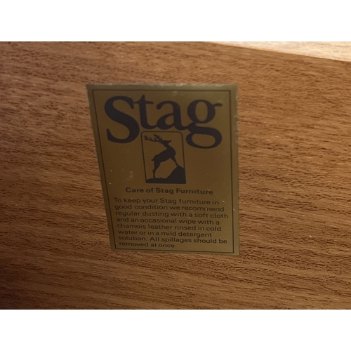 1414 - A pair of Stag mid century teak bedside cabinets together with a matching mirror backed dressing tab... 