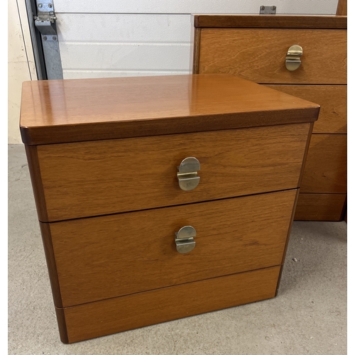 1414 - A pair of Stag mid century teak bedside cabinets together with a matching mirror backed dressing tab... 