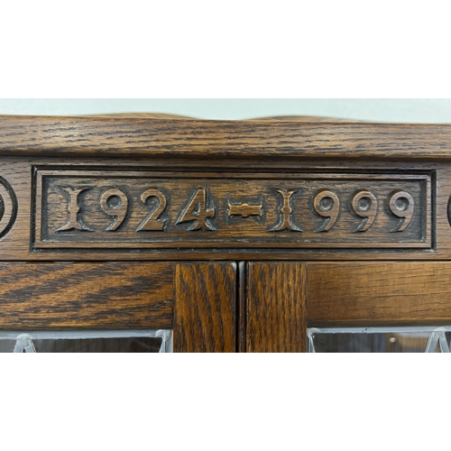 1416 - A vintage dark oak Old Charm corner unit with leaded glass doors and turned front legs. Carved detai... 