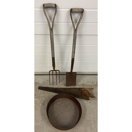 1394 - 4 vintage garden tools. A wooden handled ladies spade and fork together with a saw and a sieve.