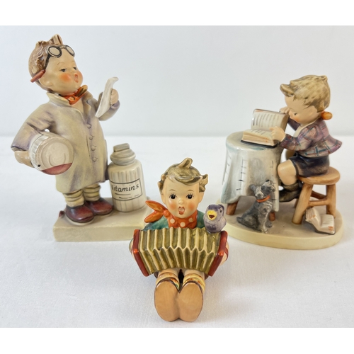 3 vintage Goebel ceramic Hummel figurines, 1964 - 72, 2 with Royal Arcade Hallams Norwich stickers to underside. Little Pharmacist, Little Bookkeeper and Let's Sing. All with blue back stamps to underside and in good condition.
