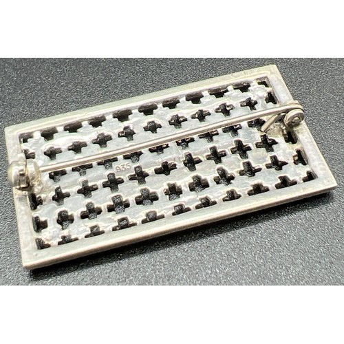 1009 - An Art Deco square shaped silver brooch set with marcasite and clear stones. Marked 935 to back. App... 