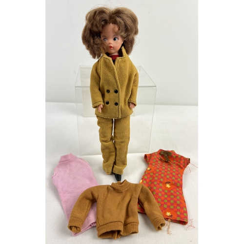 175 - A vintage 1966 Sindy doll with original Foale and Tuffin brown corduroy trouser suit 12S19. Together...