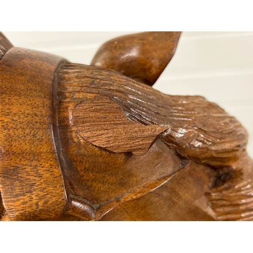 A vintage hand carved hardwood carousel style glider rocking horse. Saddle and bridle carved in wood