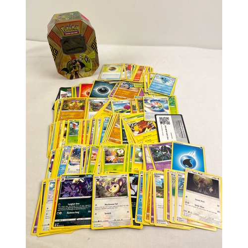 9 - 225 assorted Pokemon cards in a 2017 Alola Island Guardians Tapu Koko GX octagonal shaped tin. Cards... 