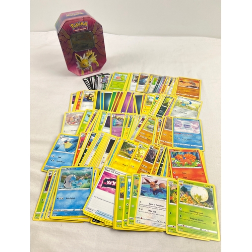 13 - 226 assorted Pokemon cards in a 2019 Pokemon - GX Jolteon octagonal shaped tin. Cards comprise 201 c... 