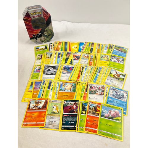 20 - 235 assorted Pokemon cards in a 2021 Pokemon V Tyranitar octagonal shaped tin. Cards comprise 187 ch... 