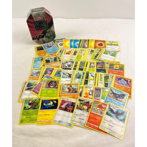 29 - 226 assorted Pokemon cards in an 2021 Pokemon V Force Tyranitar V octagonal shaped tin. Cards compri... 