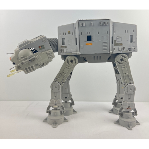 A vintage 1981 Lucasfilm Ltd, Kenner Product Star Wars, The Empire Strike Back At-At Imperial Walker. With original decals, cannons and side guns present. Total height approx. 42cm tall.