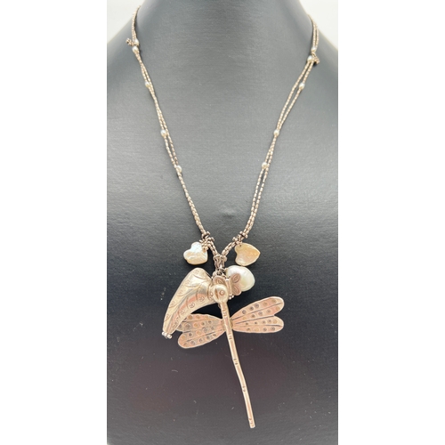 1012 - A modern white metal dragonfly pendant necklace with heart shaped & natural freshwater pearl pendant... 