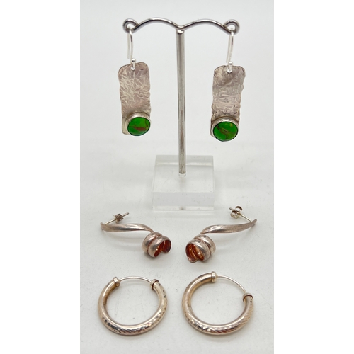 1034 - 3 pairs of modern design silver and white metal earrings in various styles. A pair of hoops with dia... 