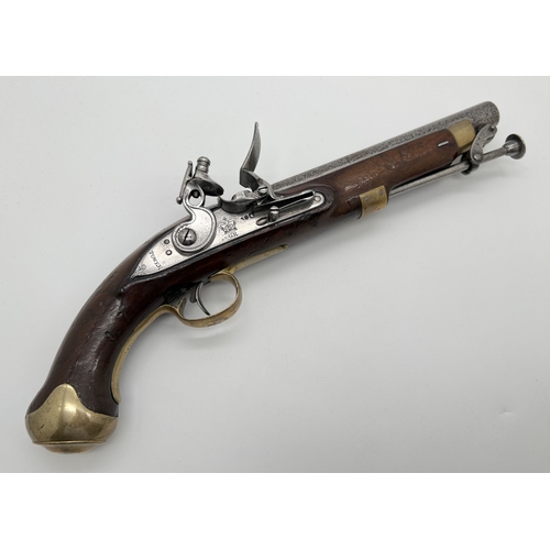 An antique Tower Naval.58 caliber flintlock pistol. Wooden stock with brass trigger and butt guard. Tower name and crown over GR stamped to plate. Trigger guard stamped with initials M.Y.C. D 58. Total length approx. 38cm.