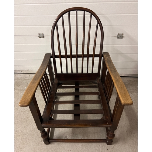 1415 - A vintage Arts & Crafts style recliner dark wood chair with curved spindle back. With re upholstered... 