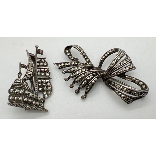 7 - 2 vintage silver brooches, both set with marcasite stones. A decorative bow brooch together with a G... 