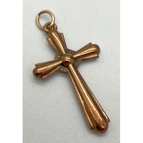 11 - A vintage 9ct rose gold cross shaped pendant with hanging bale. Approx. 3cm x 1.75cm. Hallmarks to b... 