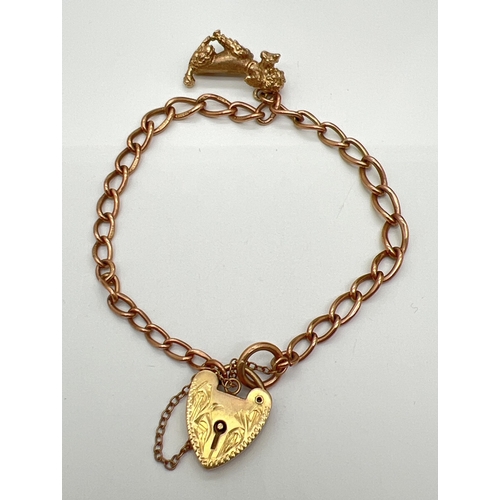 A vintage 9ct rose gold belcher chain link bracelet with yellow gold floral engraved padlock & poodle dog charm (both also 9ct). Charm approx. 2.5cm tall. Total weight approx. 16.3g. All items hallmarked - bracelet hallmarked on each link.