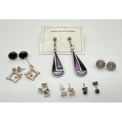 49 - 7 pairs of silver and white metal earrings in both stud and drop styles. To include bubble hearts, s... 