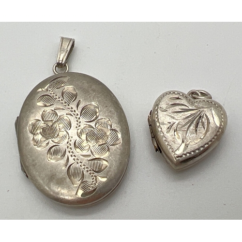 61 - 2 vintage silver lockets. An oval locket with floral engraved detail to front, together with a heart... 