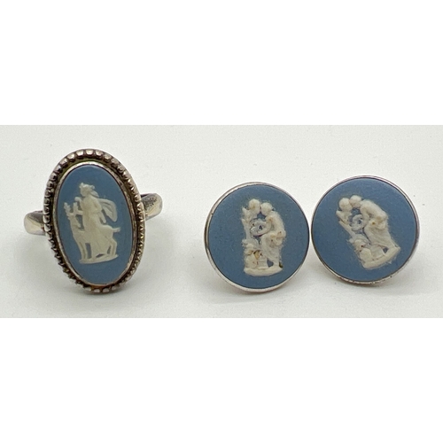 67 - A vintage silver dress ring and a pair of stud earrings both set with blue ceramic Wedgwood panels. ... 