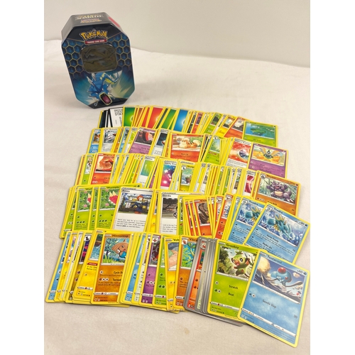 1270 - 225 assorted Pokemon cards in a 2019 Pokemon - GX Gyarados Hidden Fates octagonal shaped tin. Cards ... 